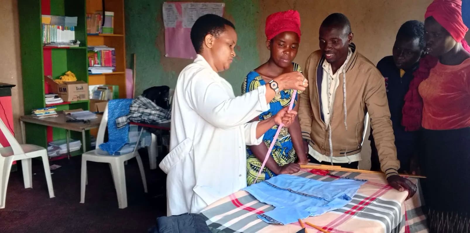 Teaching young women in Rwanda tailoring skills.